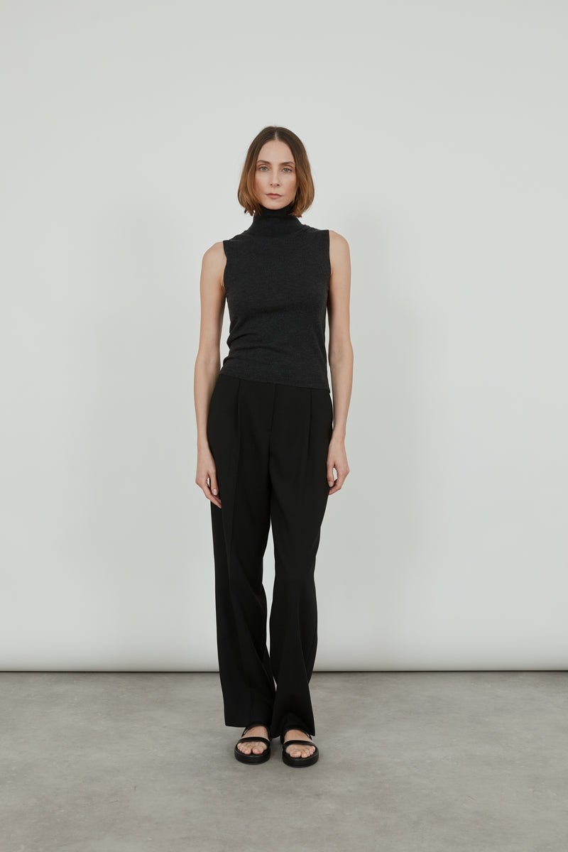 Deborah sleeveless turtleneck in the softest merino, cashmere and silk blend with black tailored trousers. 