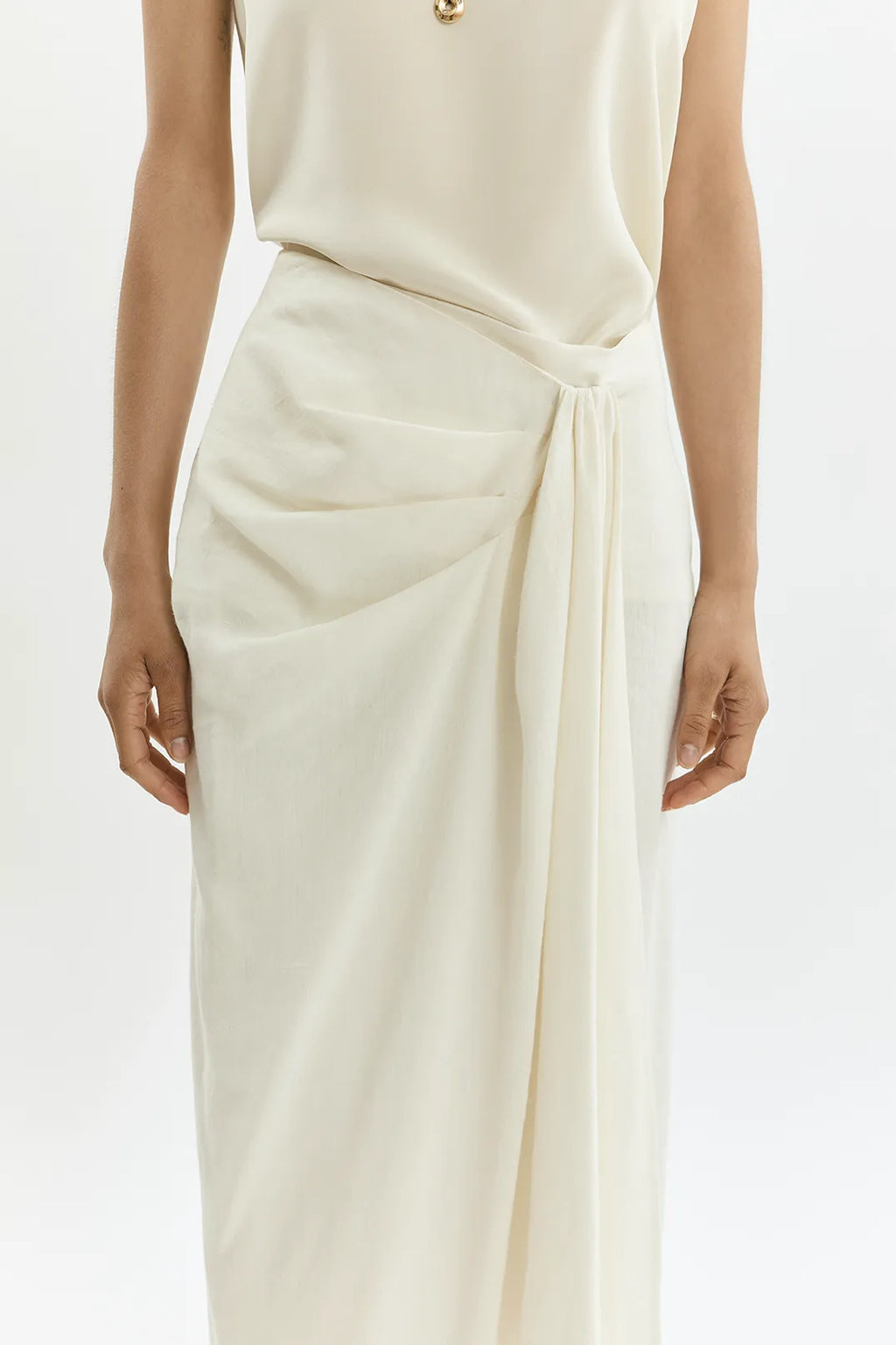 Front view of Pamela cream cotton silk wrap skirt with low waist and draped silhouette