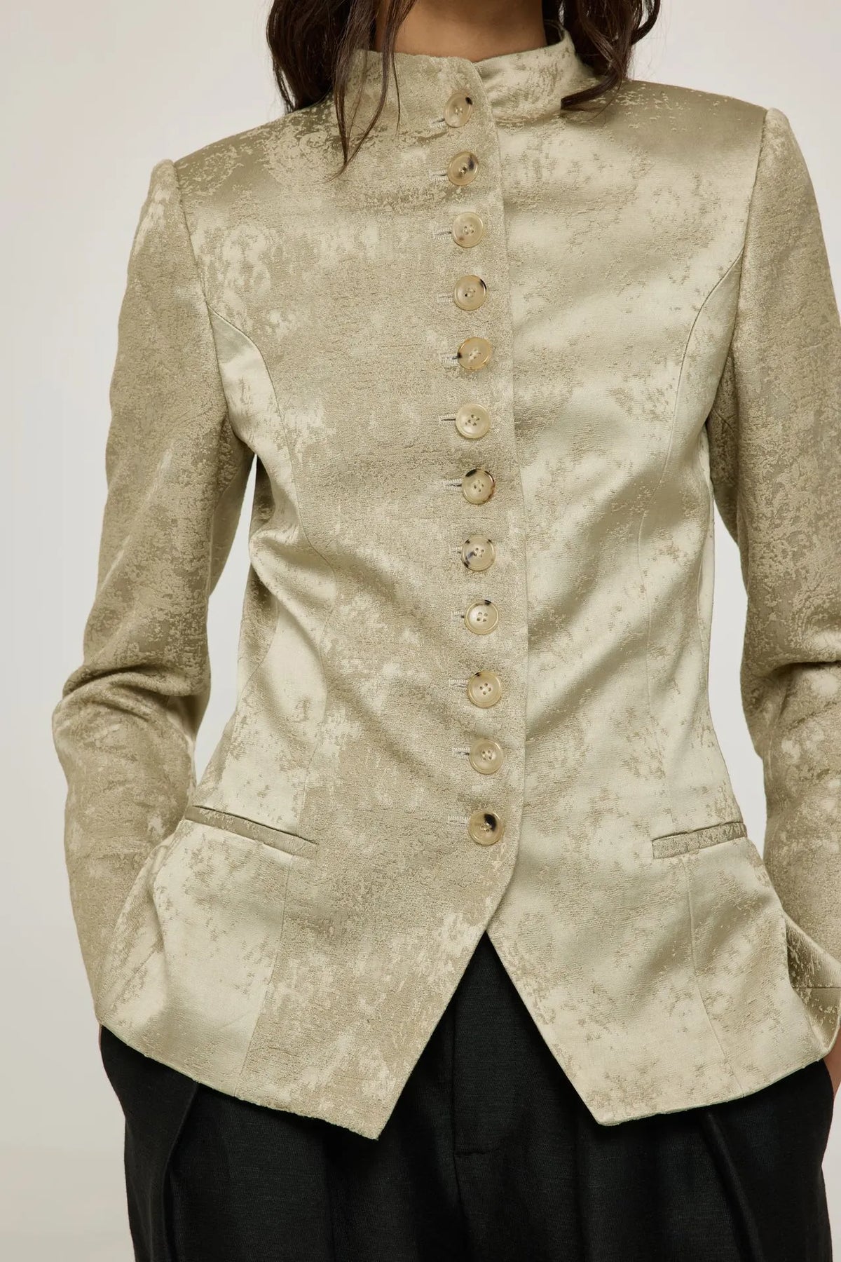 Close-up of the high collar and gold viscose-blend fabric on the Margaret blazer.