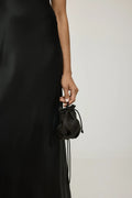 Bowie coin purse in black-print mud silk, front view.