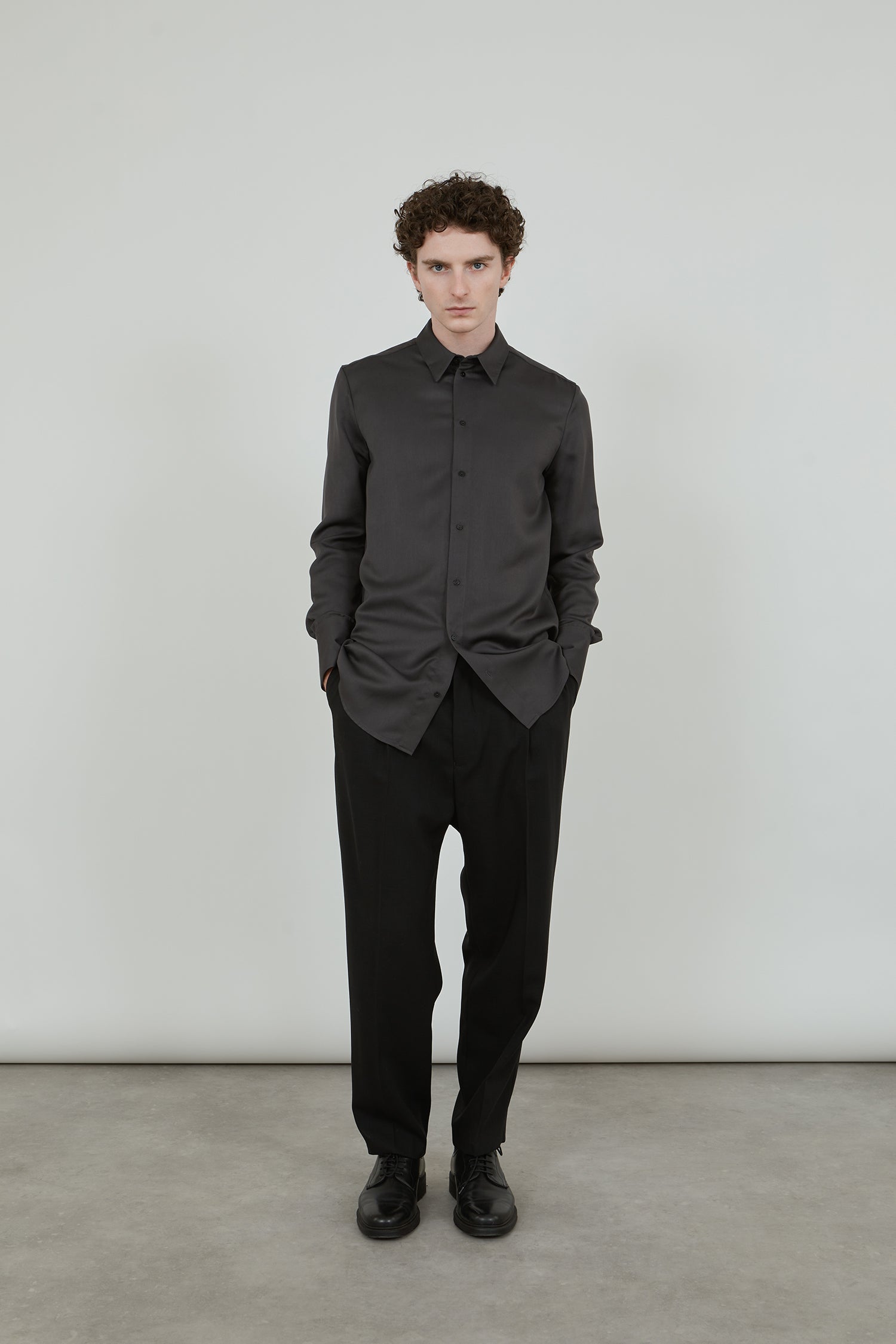 aubergine grey shirt in soft viscose on black pants.