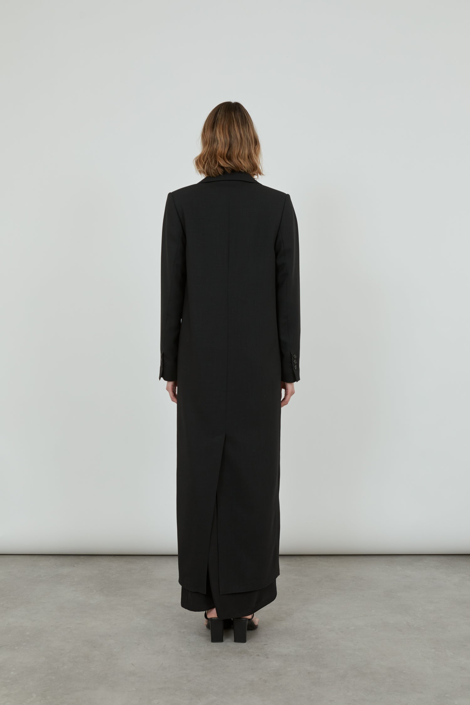 Black virgin wool coat from the back