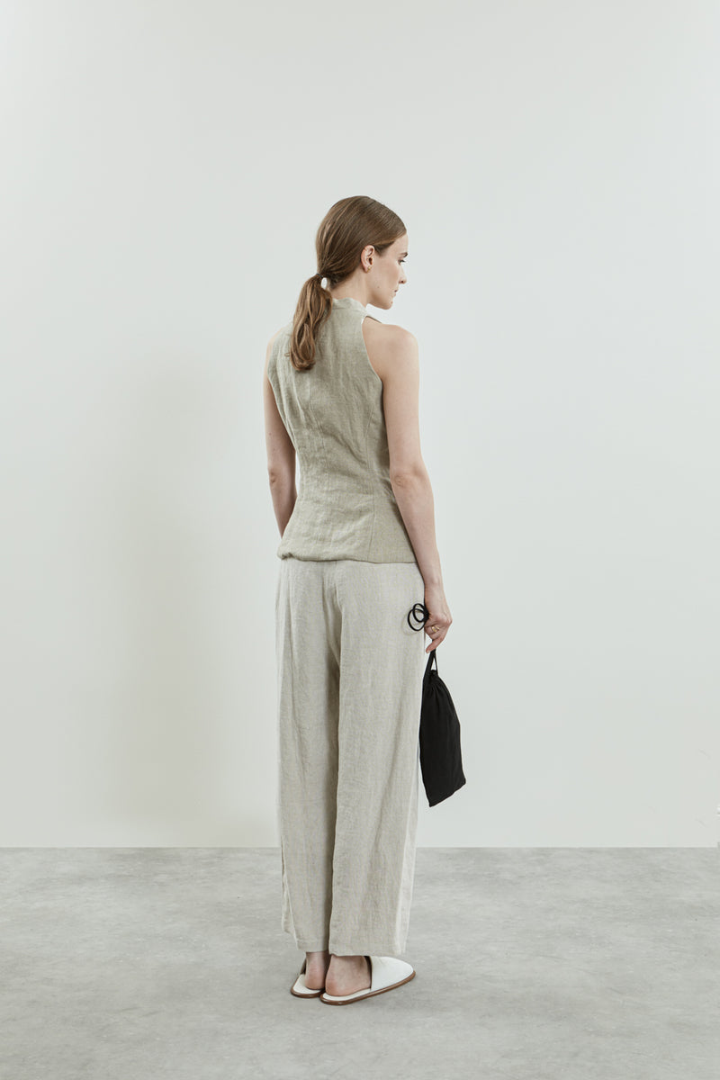 Back view of the Akari gilet in beige linen.