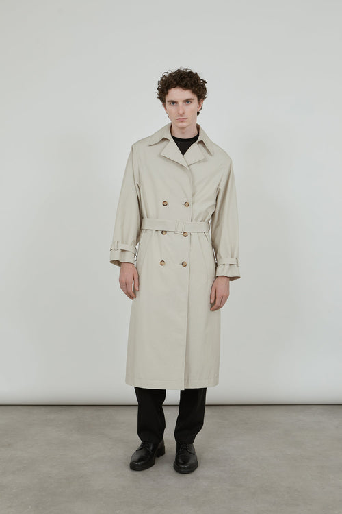 Full-length view of the beige Alex coat and Macha scarf, featuring raglan sleeves, a tonal belt.