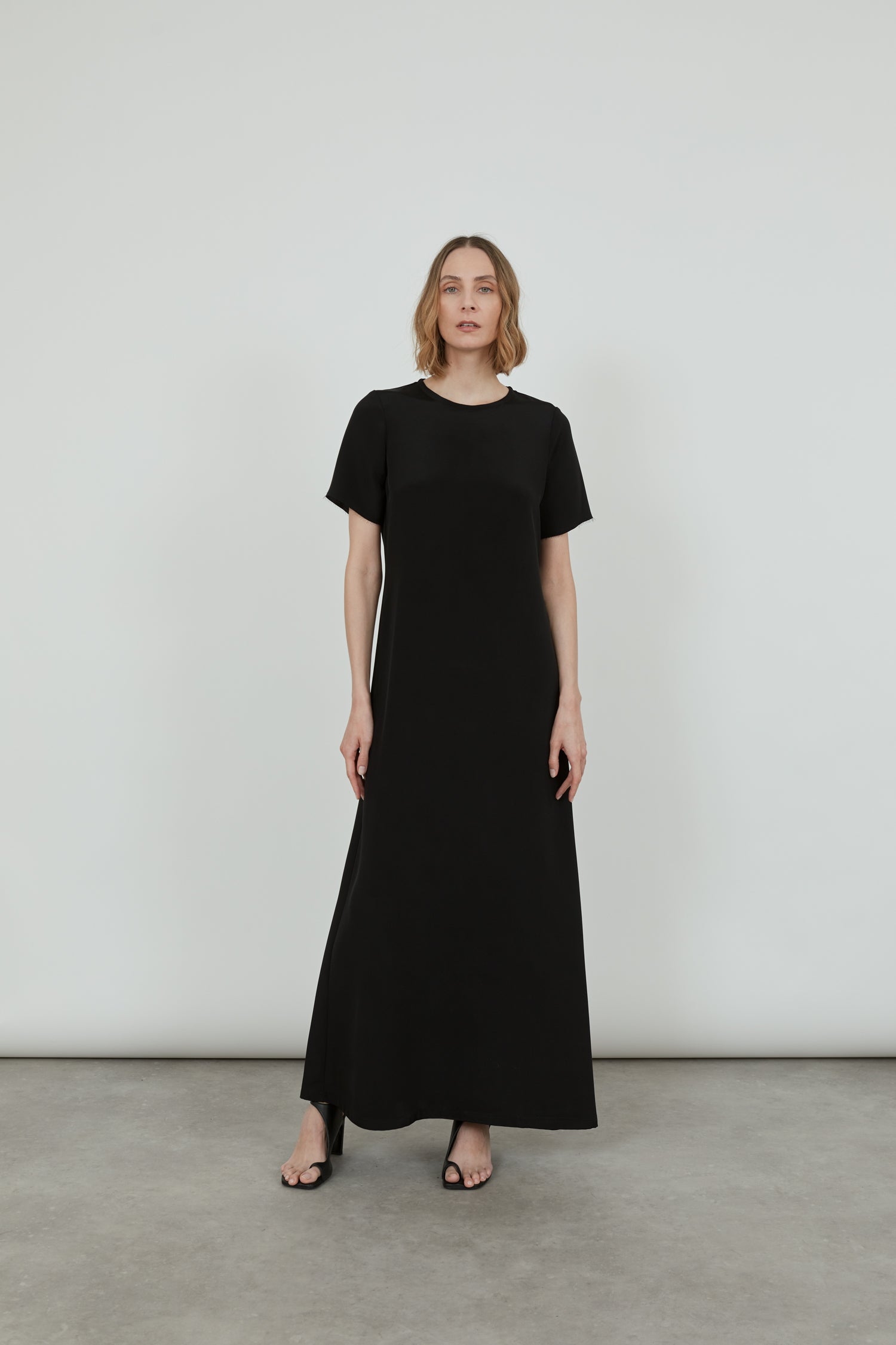 Front view of the black Celine dress in crepe silk.