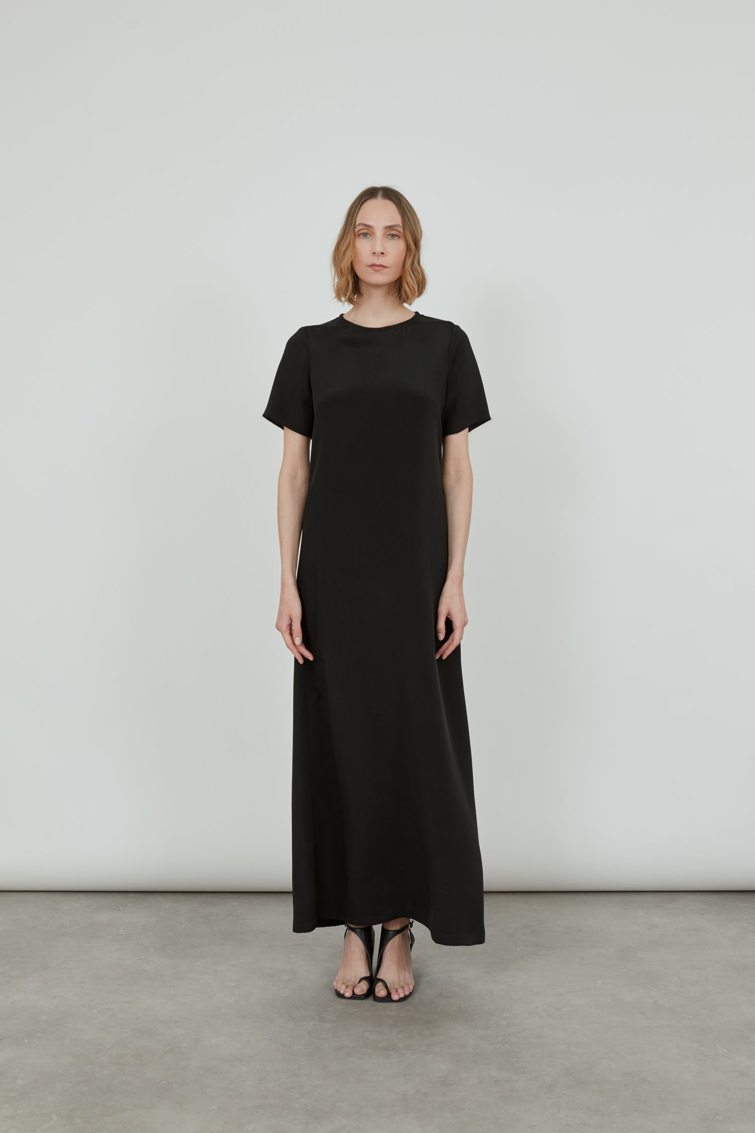 Front view length Celine dress in black crepe silk.