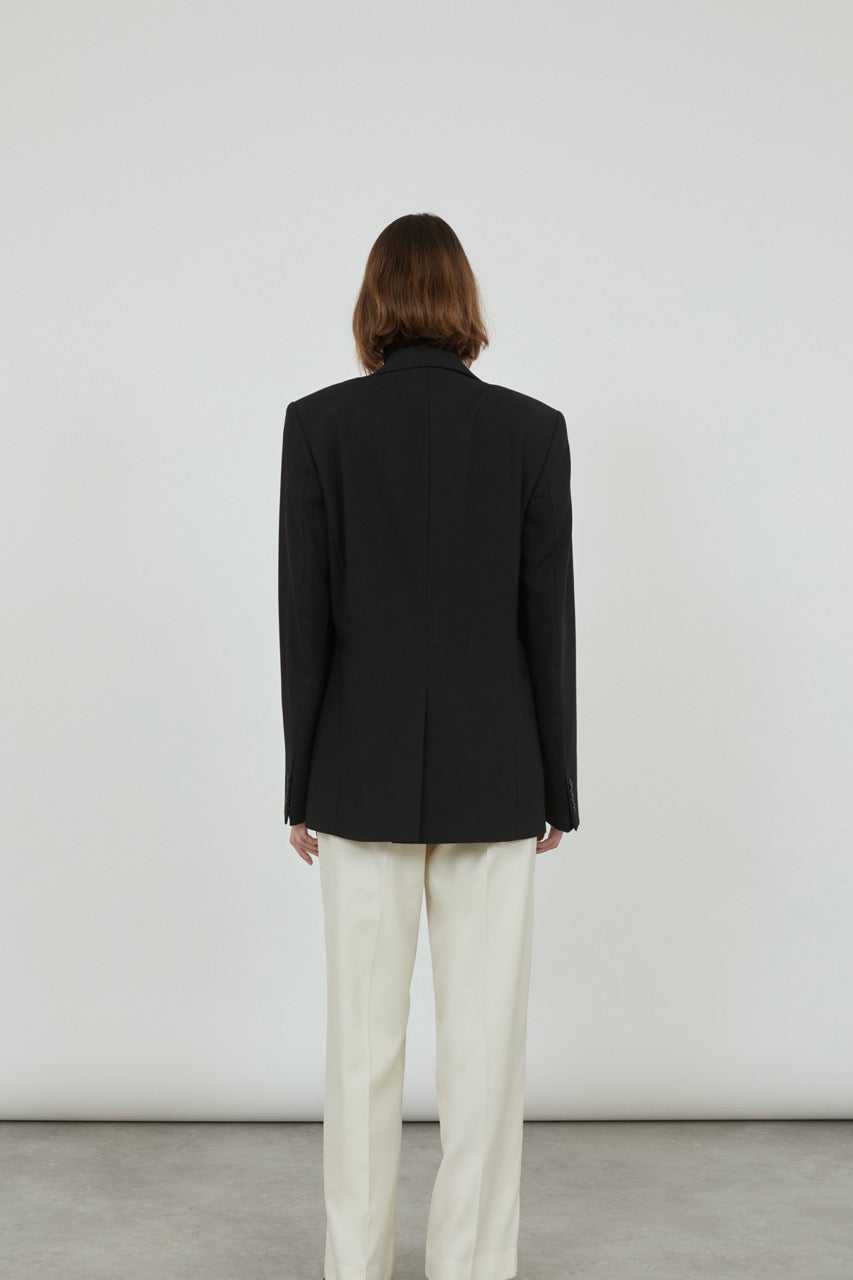 Back view of the Morris blazer in black virgin wool.