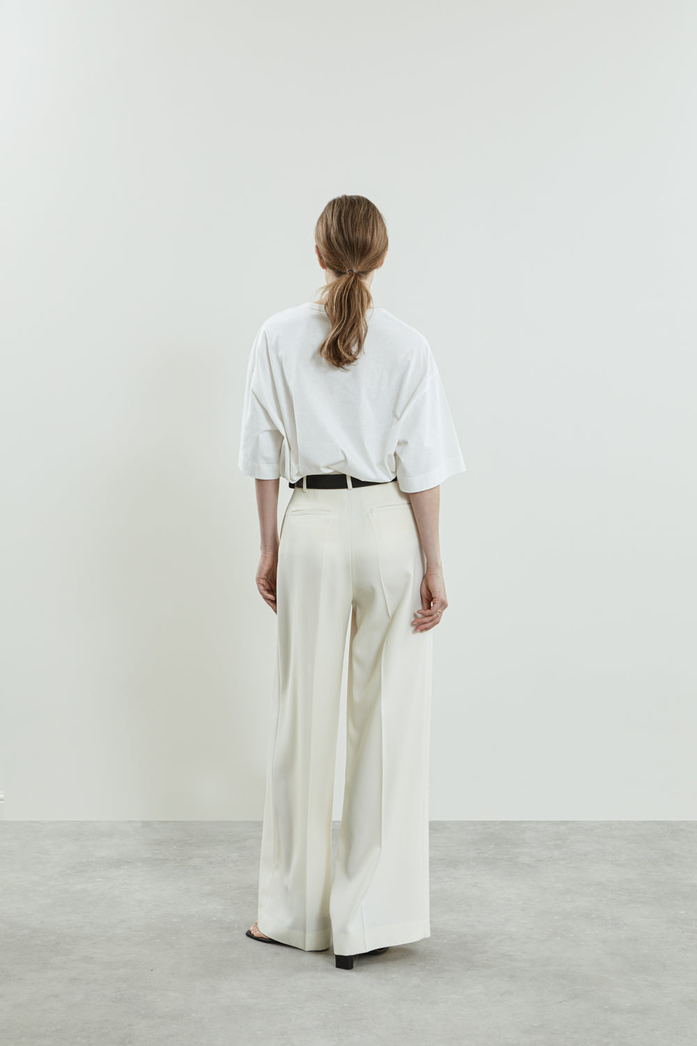 Back view of the off-white Dalida trousers in virgin wool.