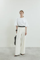 Front view of the off-white Dalida trousers in virgin wool, featuring a high-waisted design.