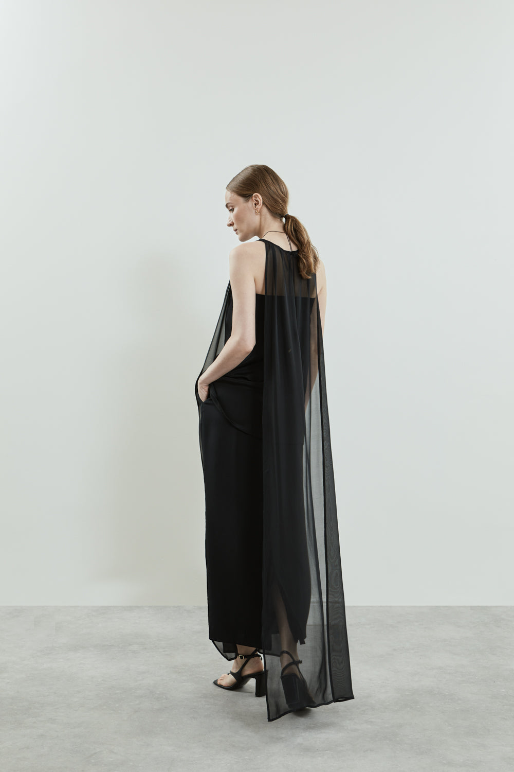 Back view of the black Danni dress in chiffon silk.