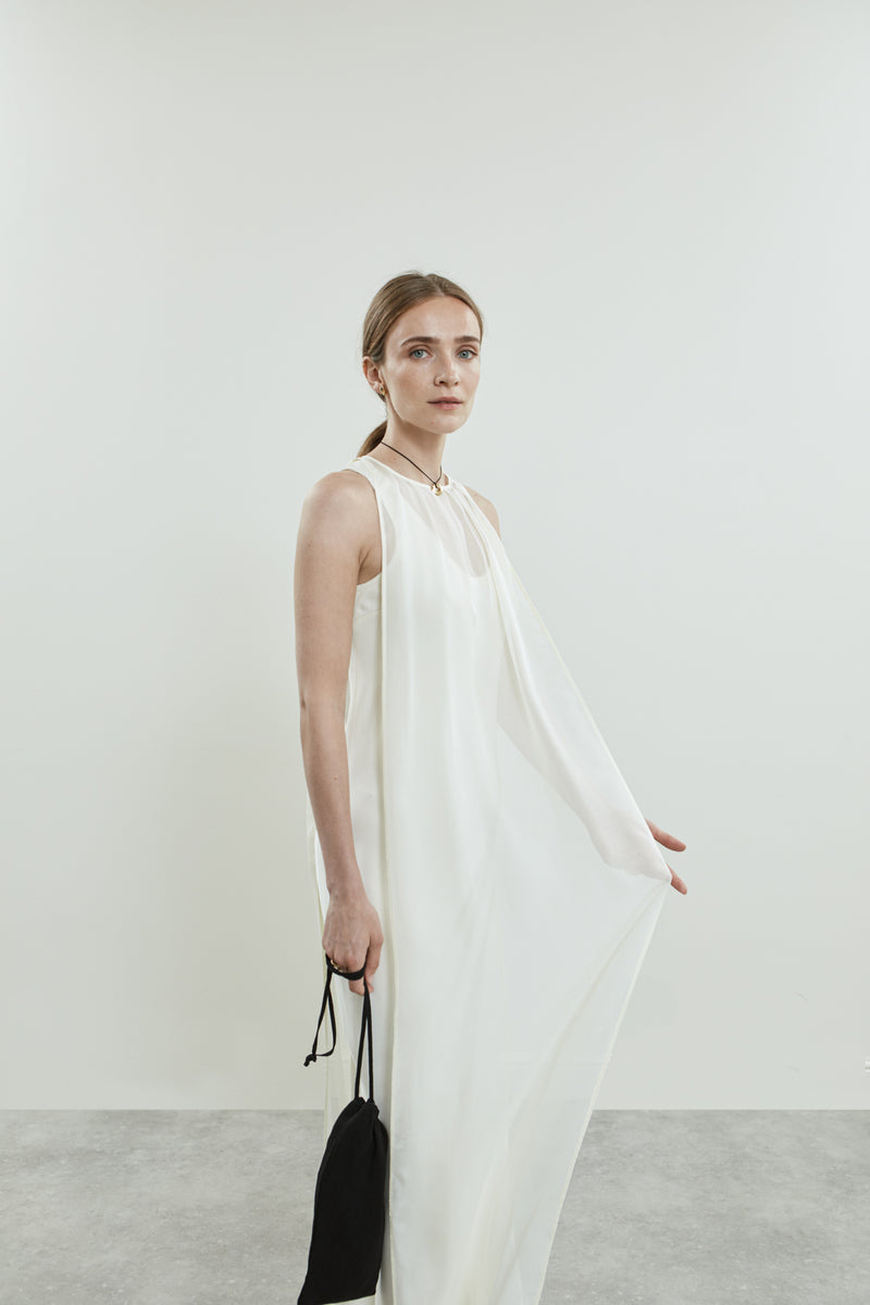 Close-up of the off white chiffon silk fabric of the Danni dress.