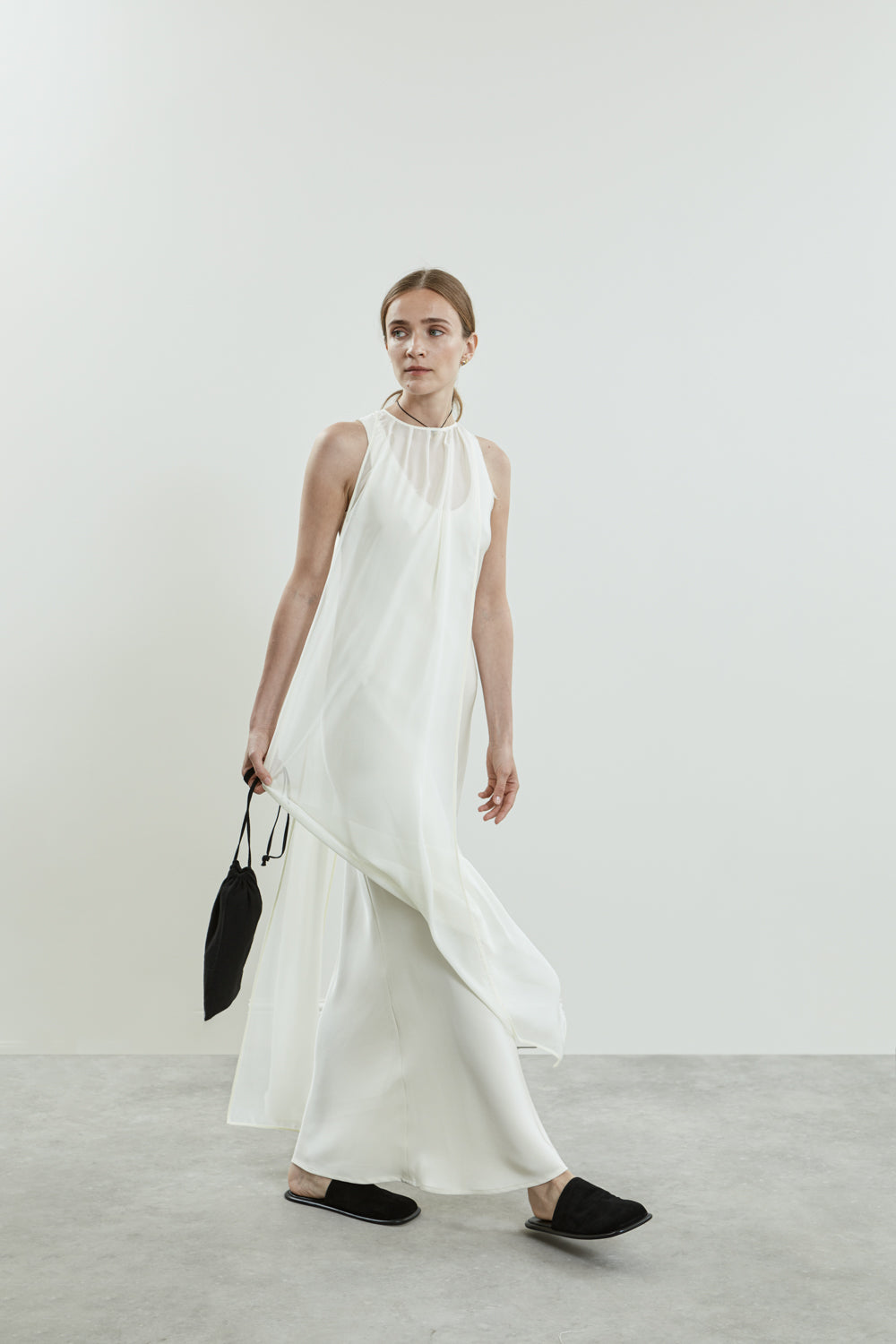 Front view of the Off white Danni dress in chiffon silk, featuring open sides.