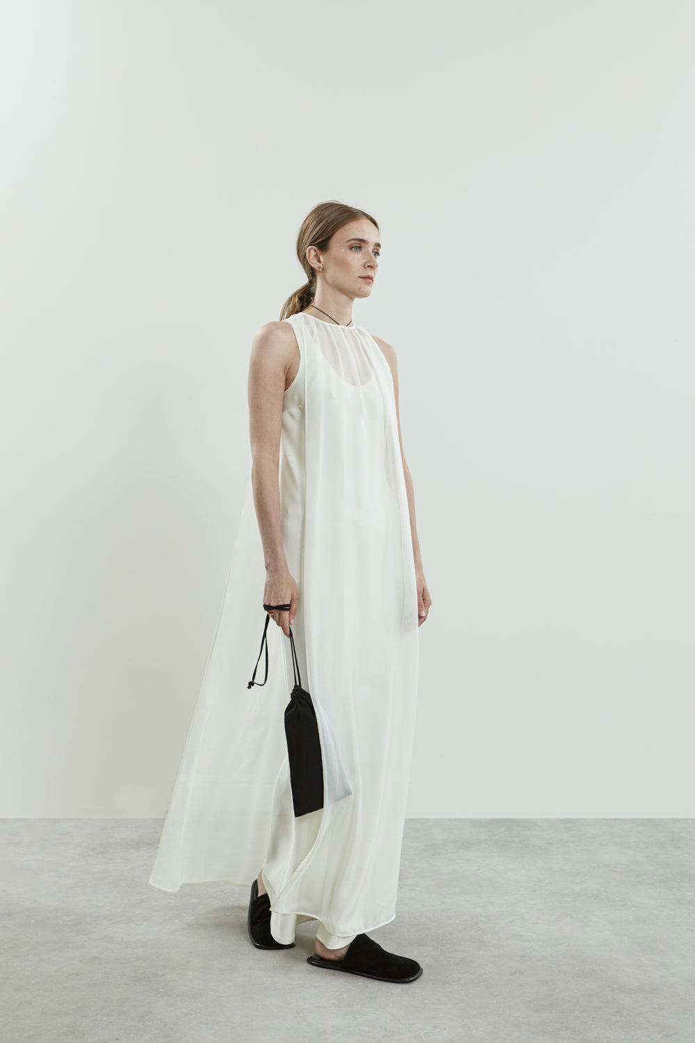 Side view of the Danni off white chiffon silk dress.
