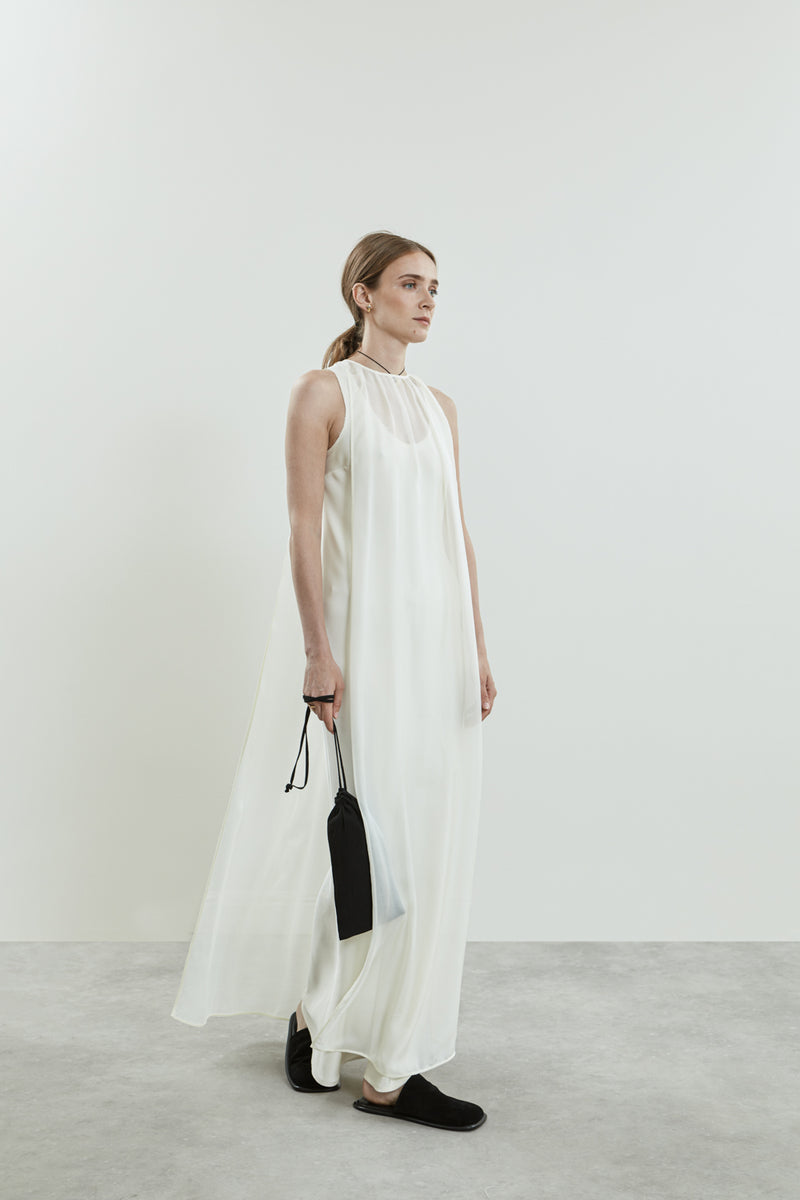 Side view of the Danni off white chiffon silk dress.
