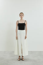 Front view of the off-white Donna skirt in virgin wool.