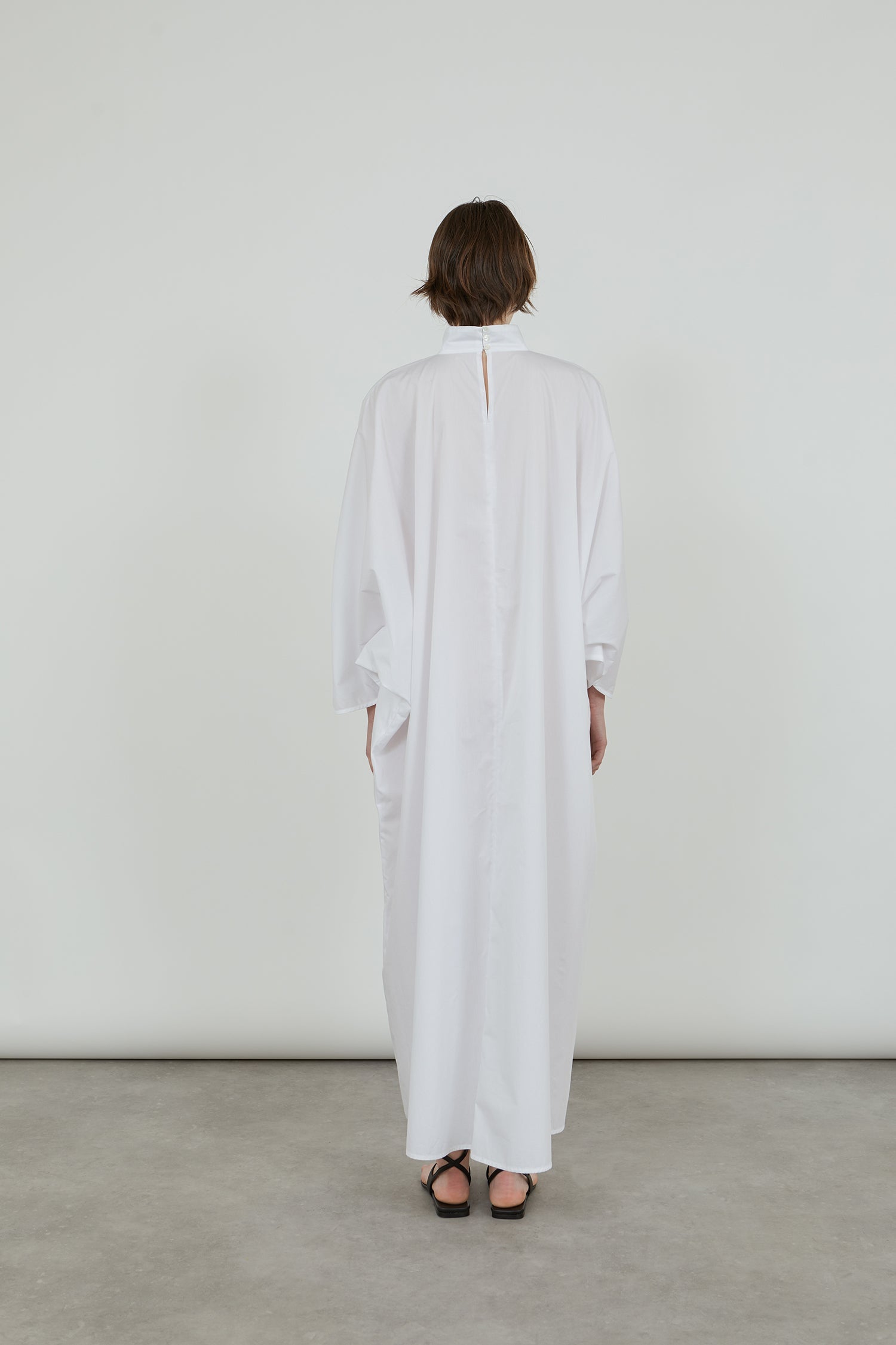 Back view of the white Emiko dress in cotton poplin.