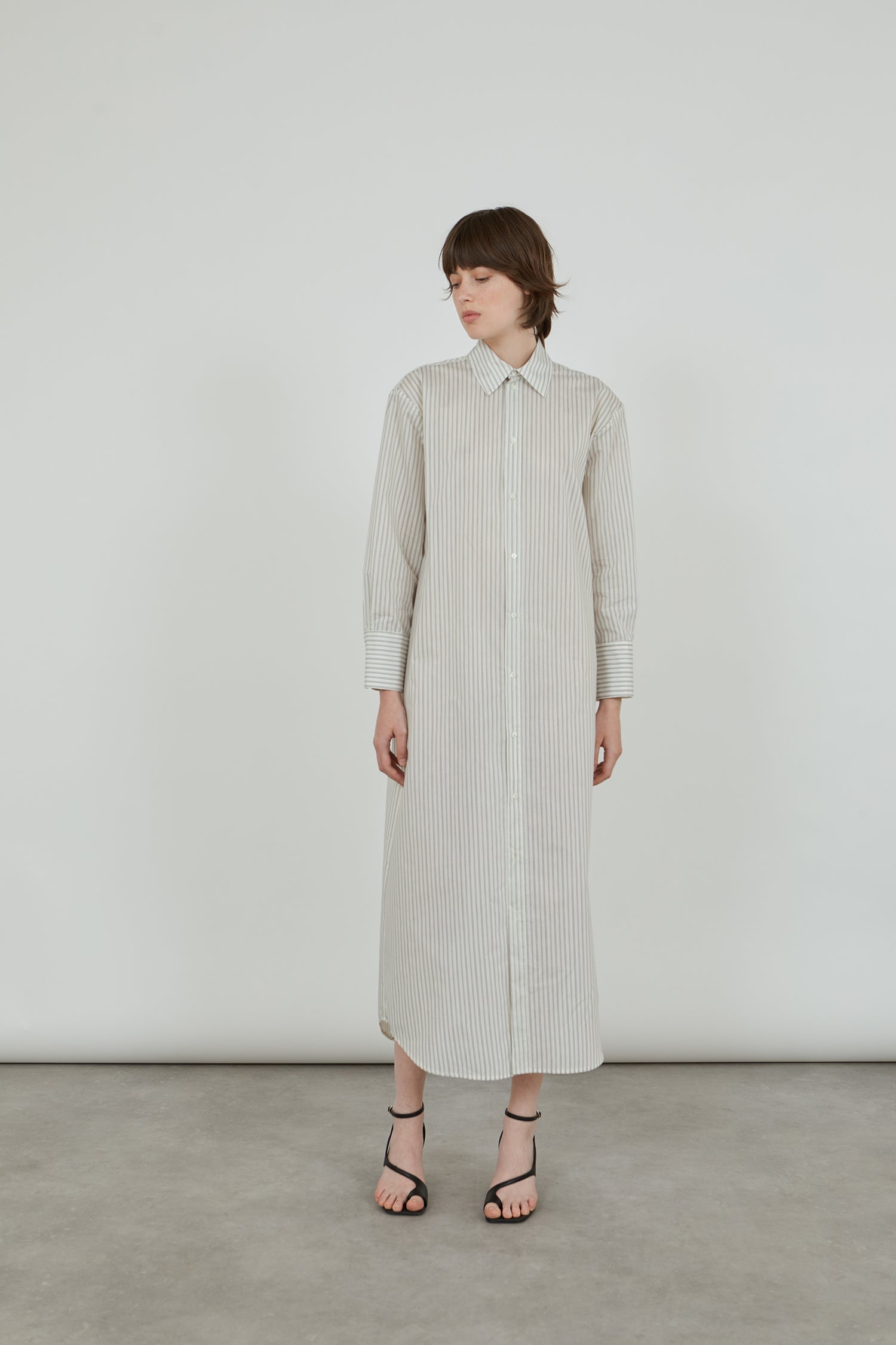 Full-length view of the striped grey-blue Freda shirtdress, crafted from breathable cotton poplin.