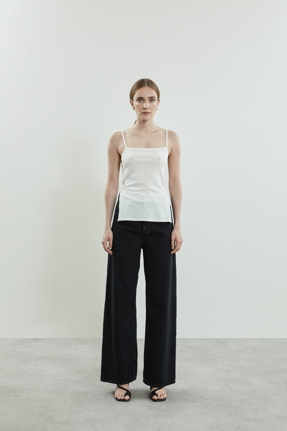 Full-length view of the off-white Harlow knitted top.