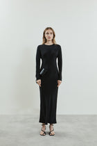 Front view of the black Jacqueline dress in fluid crepe silk, featuring a sleek silhouette, high neckline, and long sleeves, with a back slit.