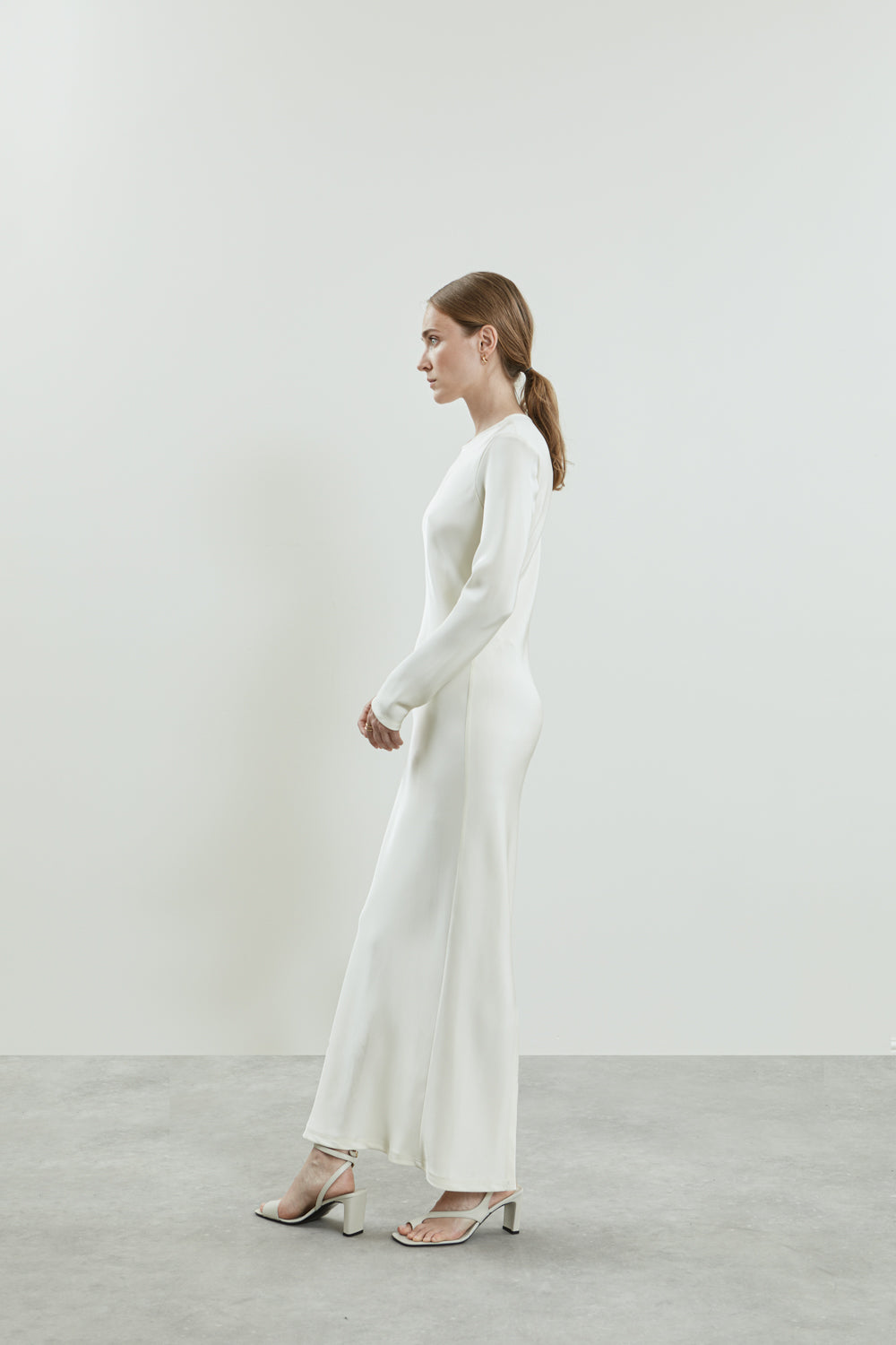 Side view of the off-white Jacqueline dress in crepe silk.