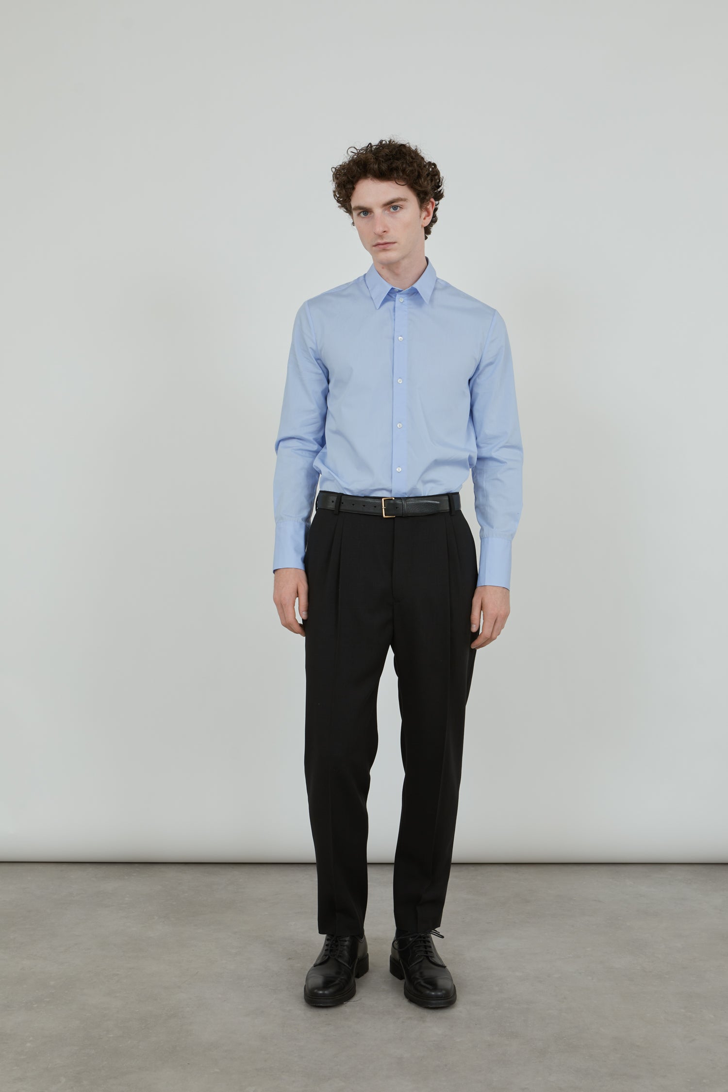 Front view of the black Constant trousers, crafted from luxurious virgin wool.