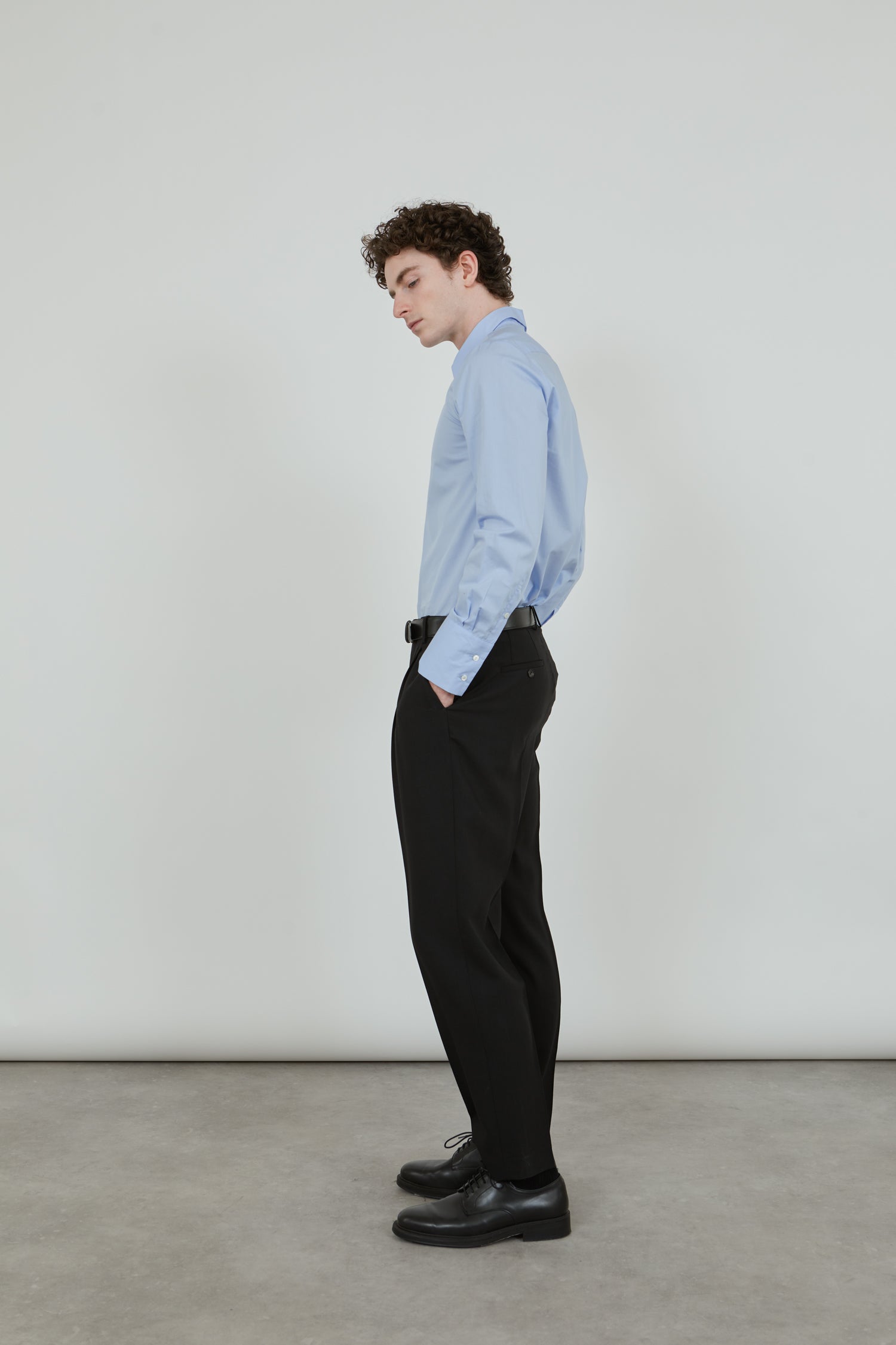 Side view of the black Constant trousers.

