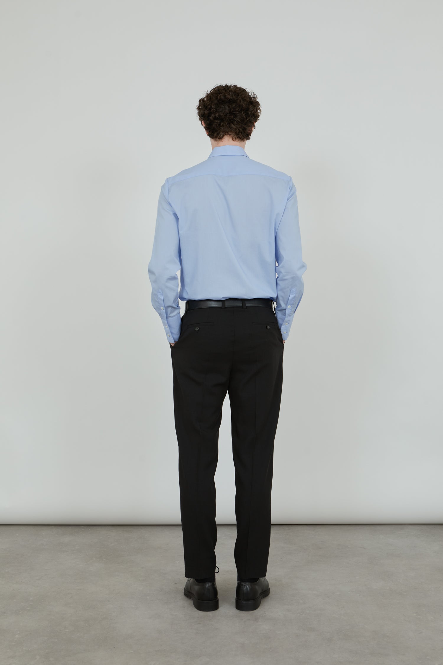 Back view of the black Constant trousers.