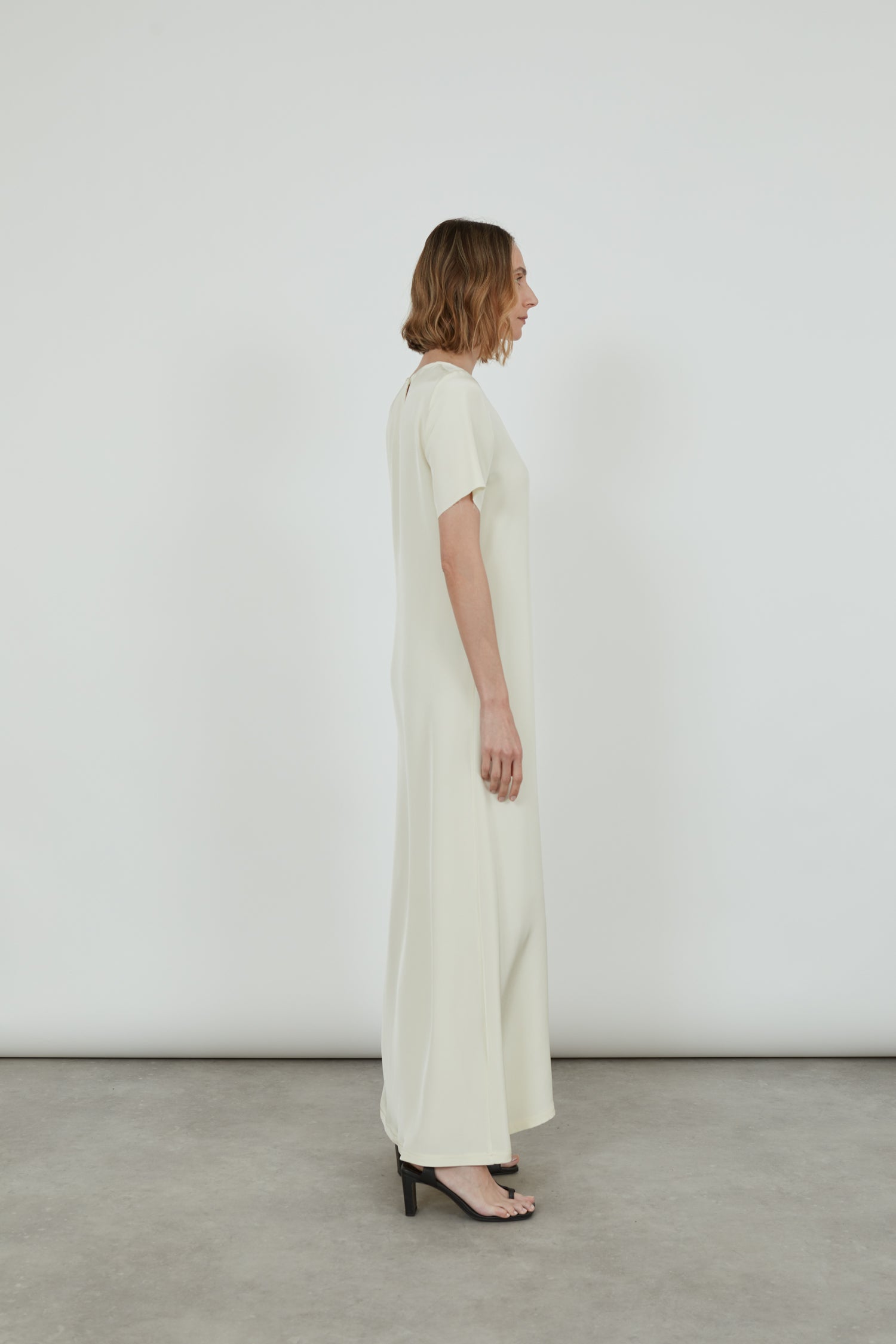 Side view of the off-white Celine dress.
