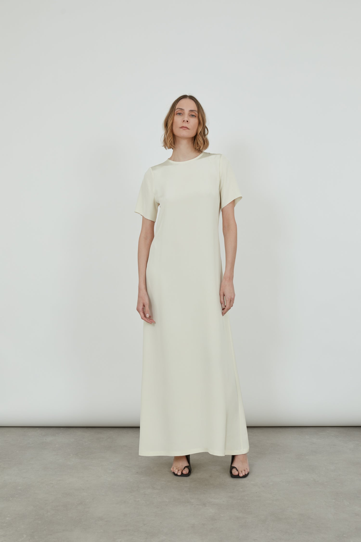 Front view of the off-white Celine ankle-length dress.