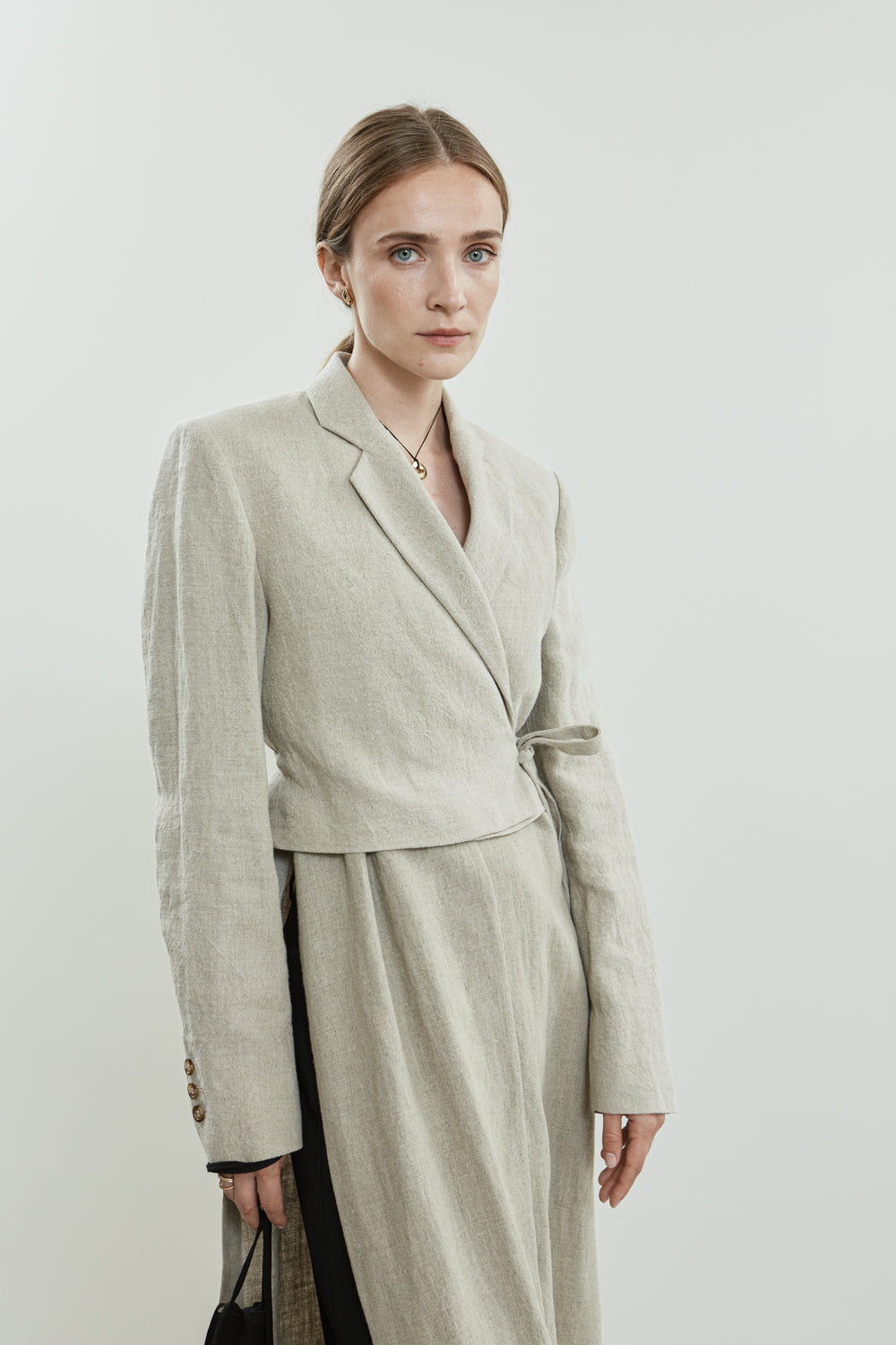 Close-up of the Lynn blazer in beige linen.
