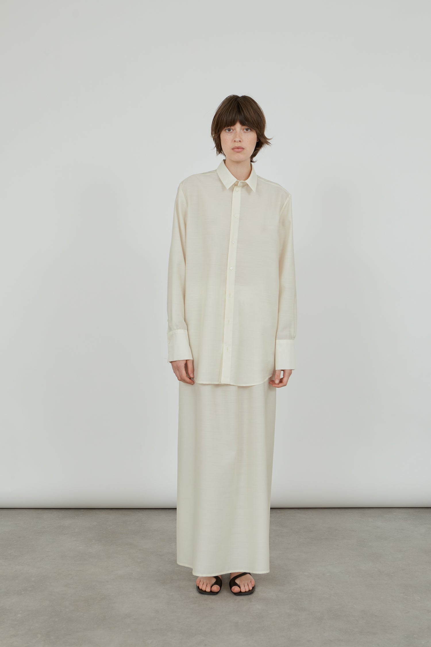 Front view of the Omani skirt in off-white wool-silk blend.