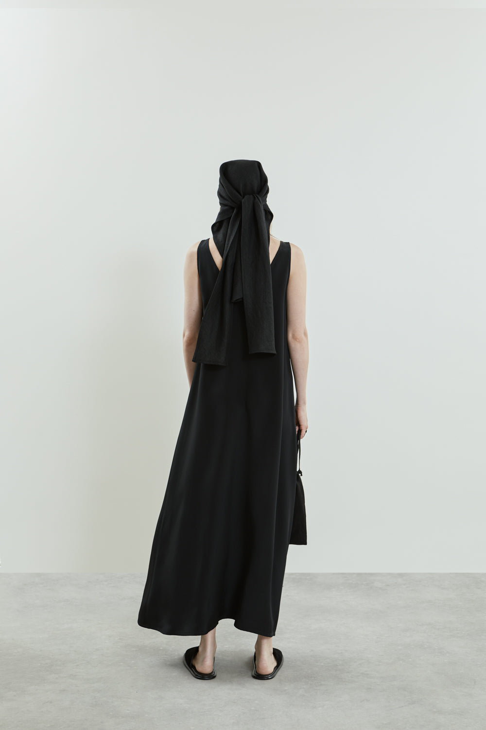 Back view of the Quinn dress in black crepe silk.