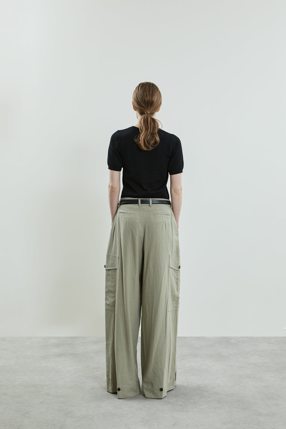 Close-up of the Stein trousers in sage linen.