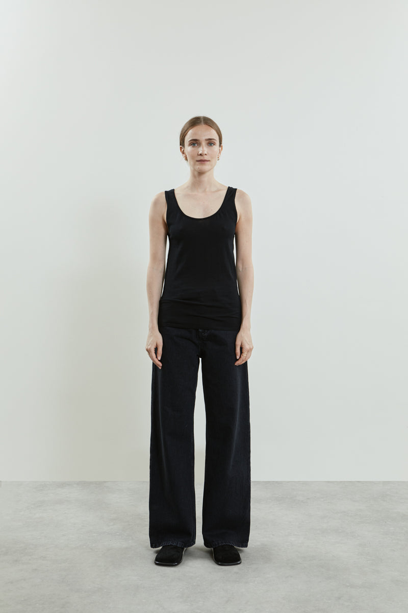 Front view of the Suzy knitted top in black cotton knit, highlighting the sleeveless tank top style, scoop neckline.