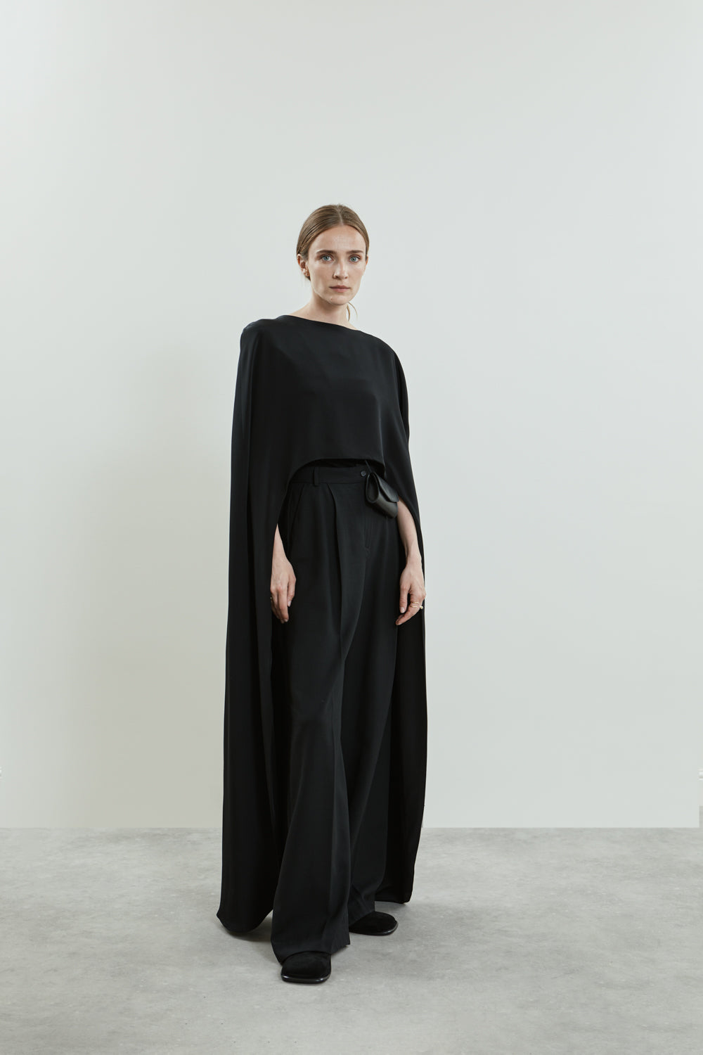 Full view of the Ursula cape in black crepe silk.