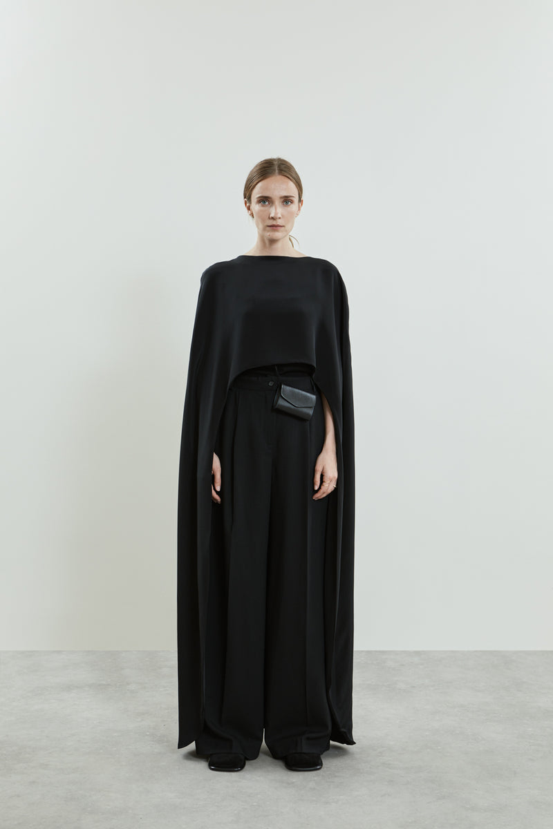 Full view of the Ursula cape in black crepe silk.