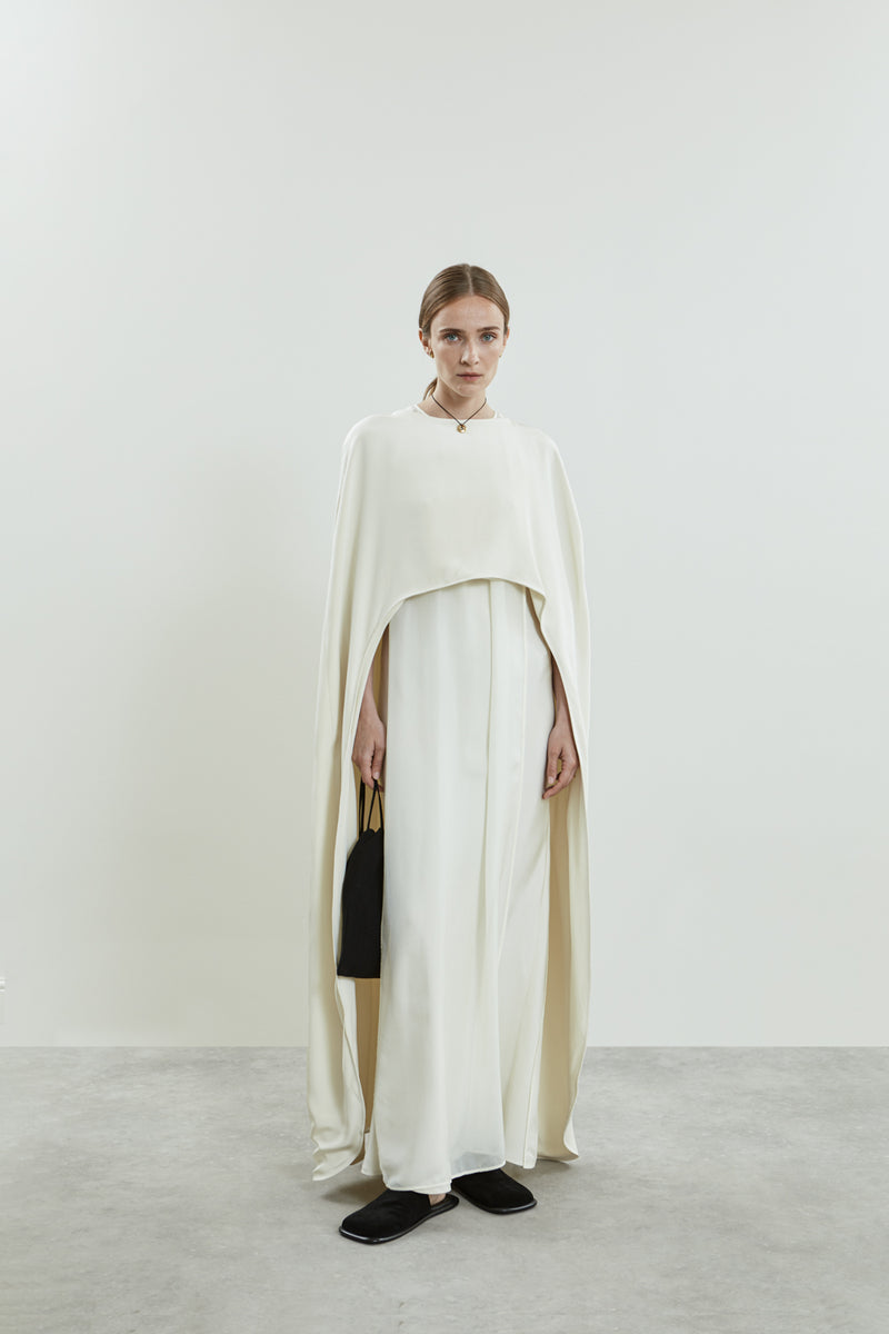 Full view of the Ursula cape in off white crepe silk.