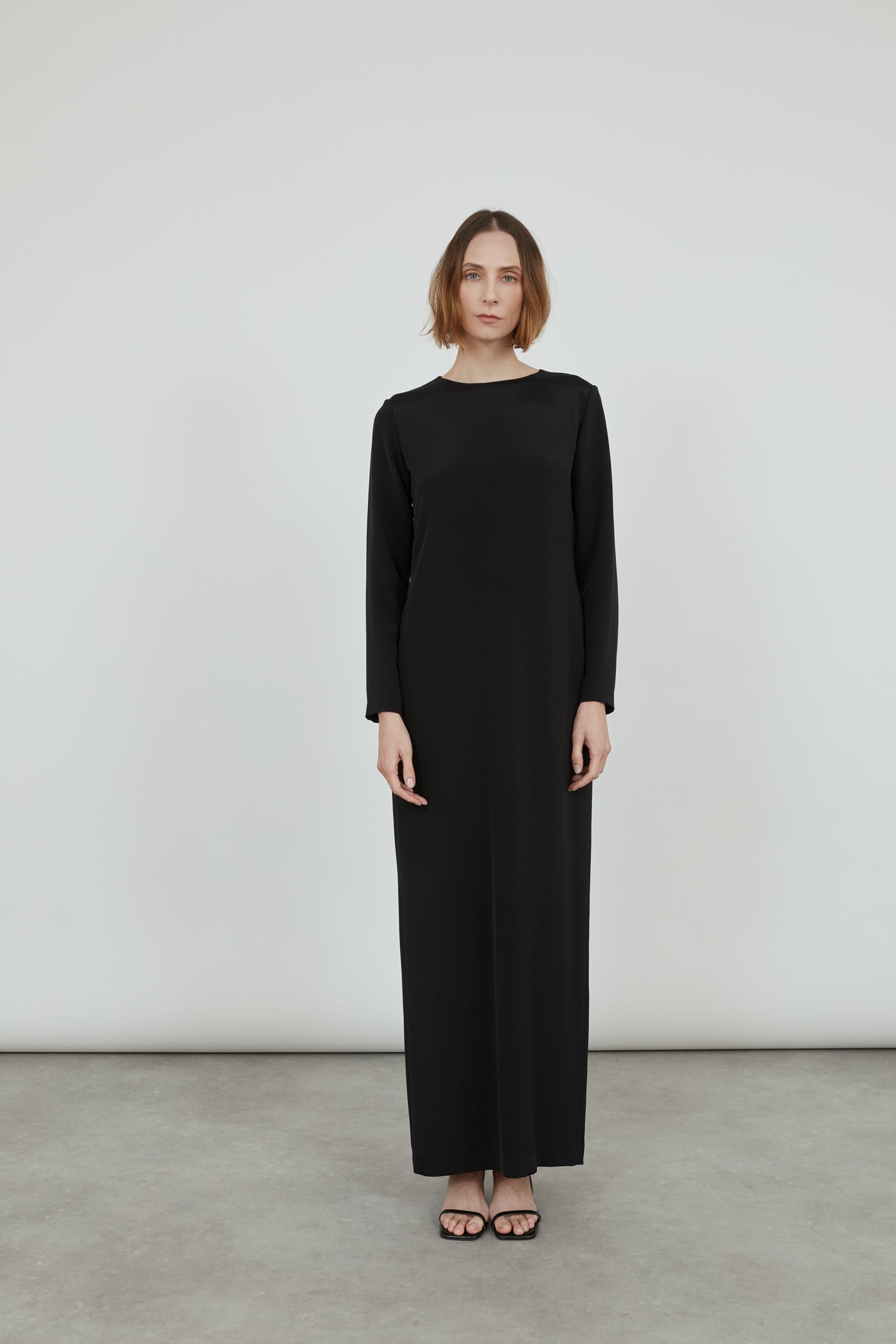 Longsleeve black Abelun maxi dress in crepe silk.